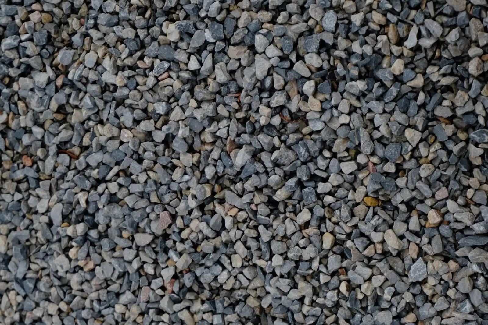 Crushed aggregate of the type compacted in lifts as base material under a concrete walk