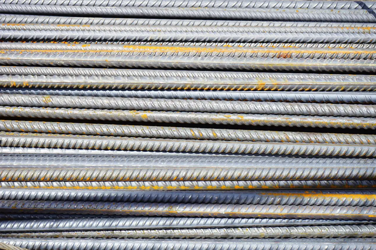 Stacked steel reinforcing bars ready for placement in footings and foundation walls